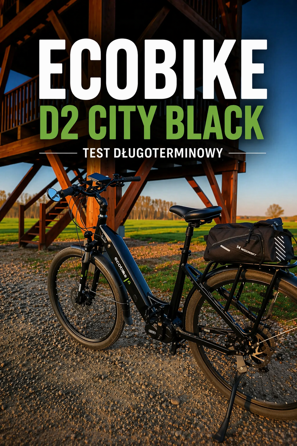 Ecobike D2 City Black – rower elektryczny trekkingowy podczas testu długoterminowego, na tle drewnianej wieży widokowej w Wielkopolsce