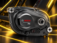 Silnik Bosch Performance Line PX do roweru elektrycznego na dynamicznym tle technicznym