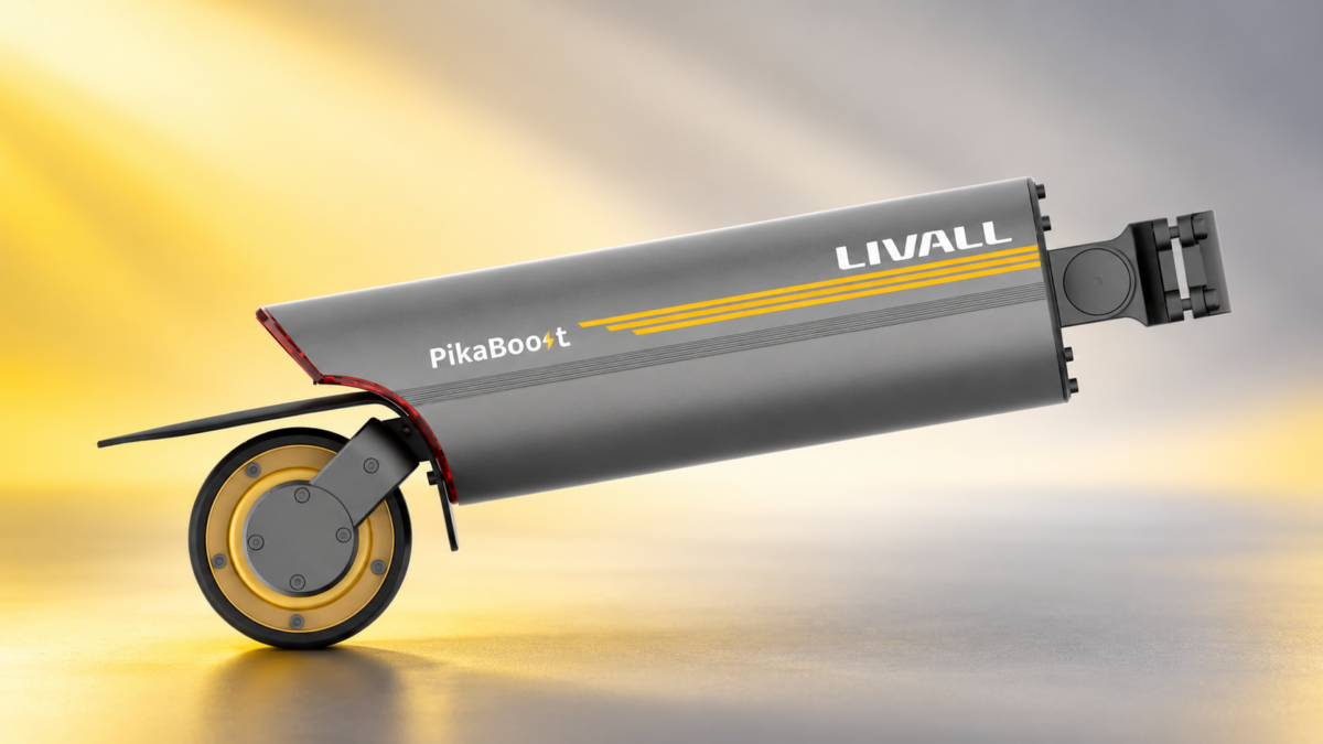 LIVALL PikaBoost 2 – napęd elektryczny do roweru z rolką cierną i mocowaniem do sztycy na żółto-szarym tle