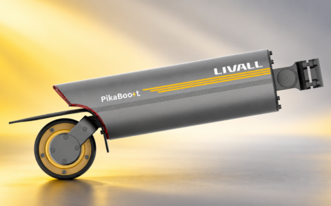 LIVALL PikaBoost 2 – napęd elektryczny do roweru z rolką cierną i mocowaniem do sztycy na żółto-szarym tle