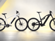 Rowery elektryczne Rockrider E-EXPL 100 i E-FEEL 900S – porównanie modeli na jasnym tle z żółtymi akcentami